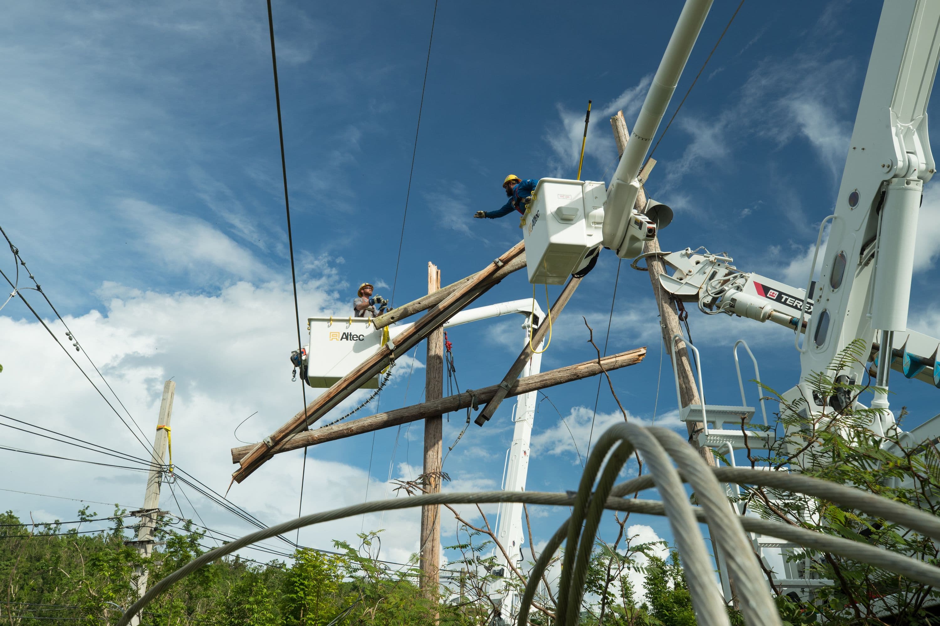 Transmission crew repairing downed power lines and poles