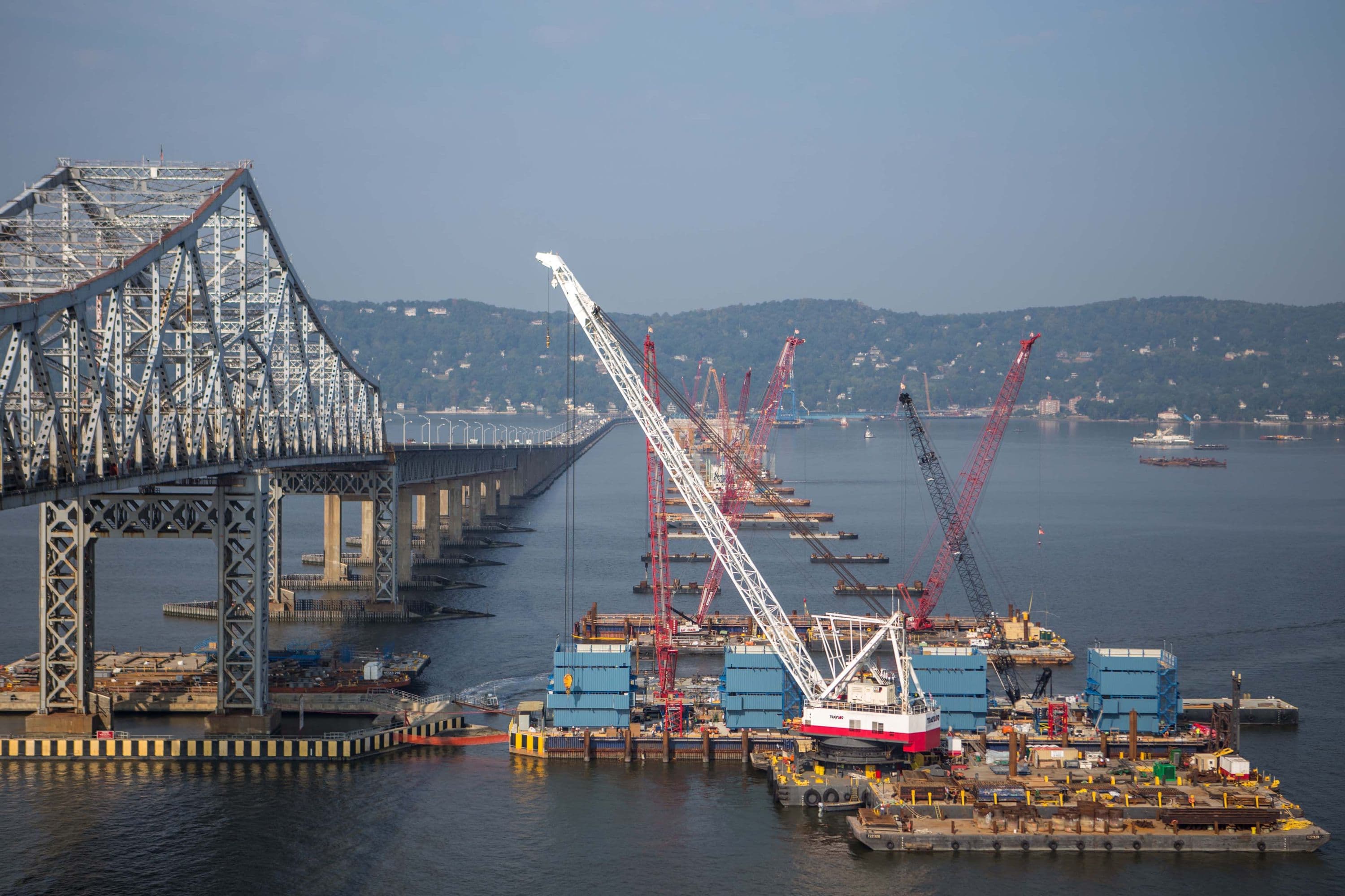 Construction begins on the new bridge's 419-foot towers atop the main span foundations.