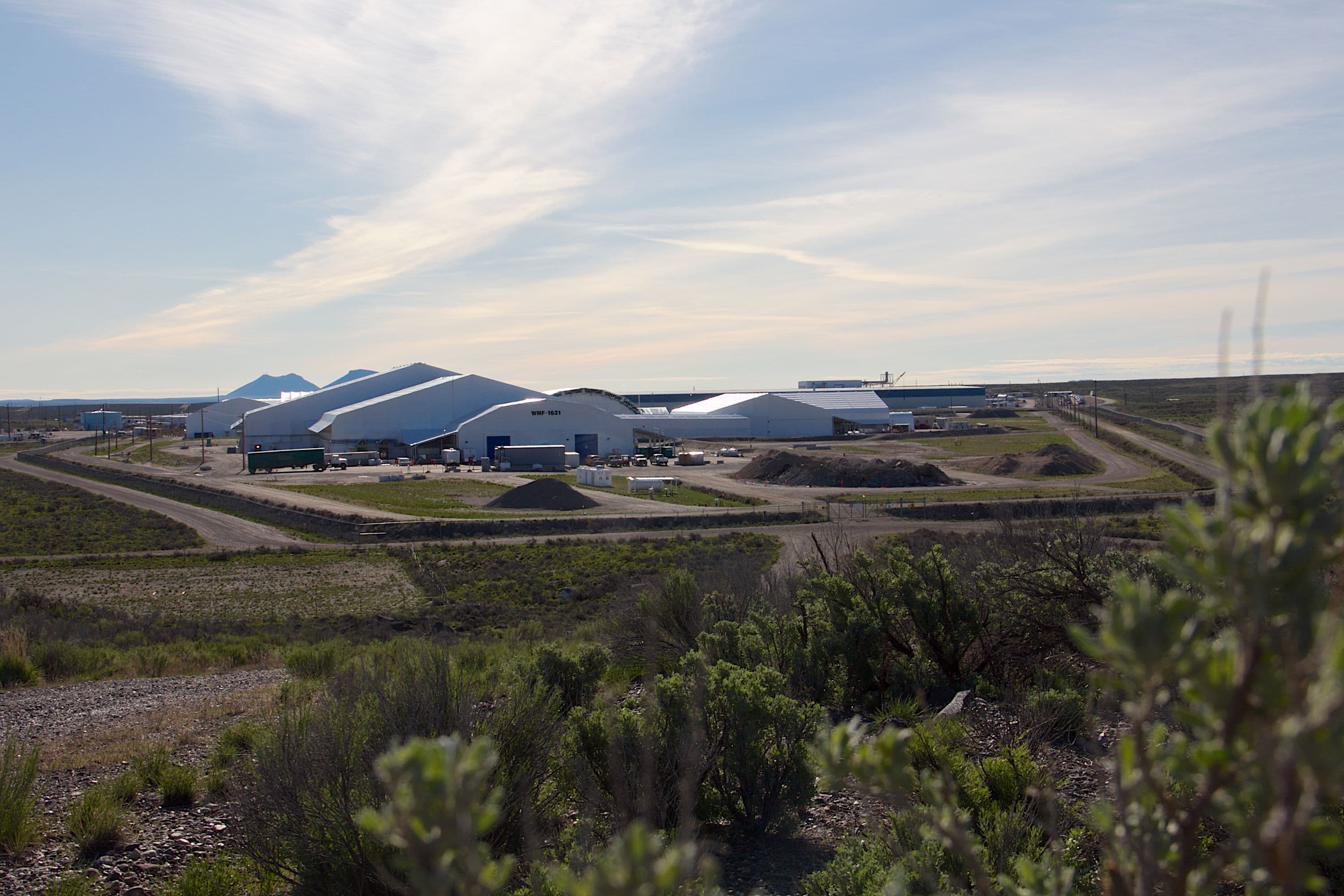 Buried transuranic waste is exhumed at the RWMC, repackaged and transported to Waste Isolation Plant for permanent disposal