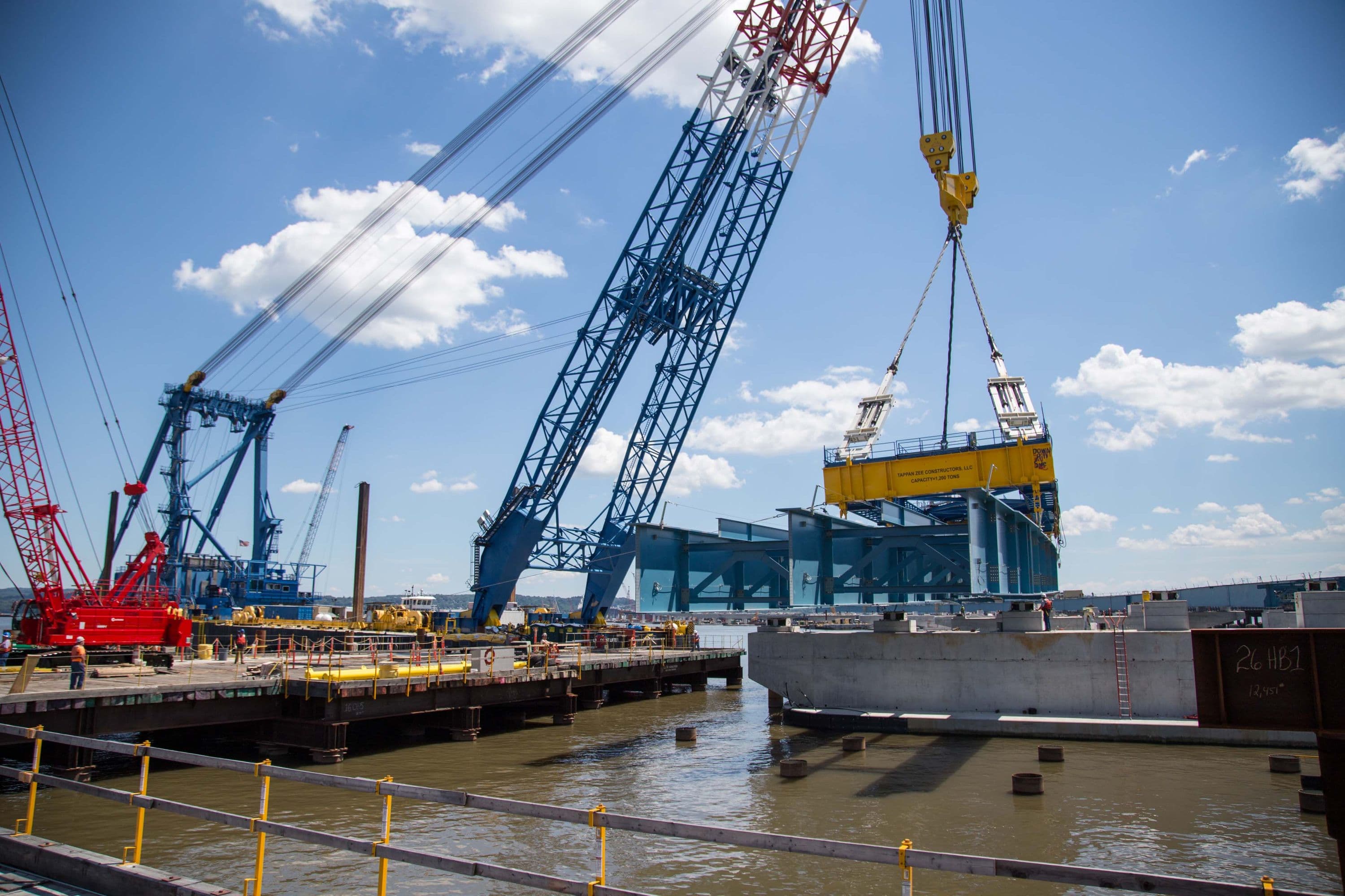 The I Lift NY super crane places an assembly of girders for the westbound span.