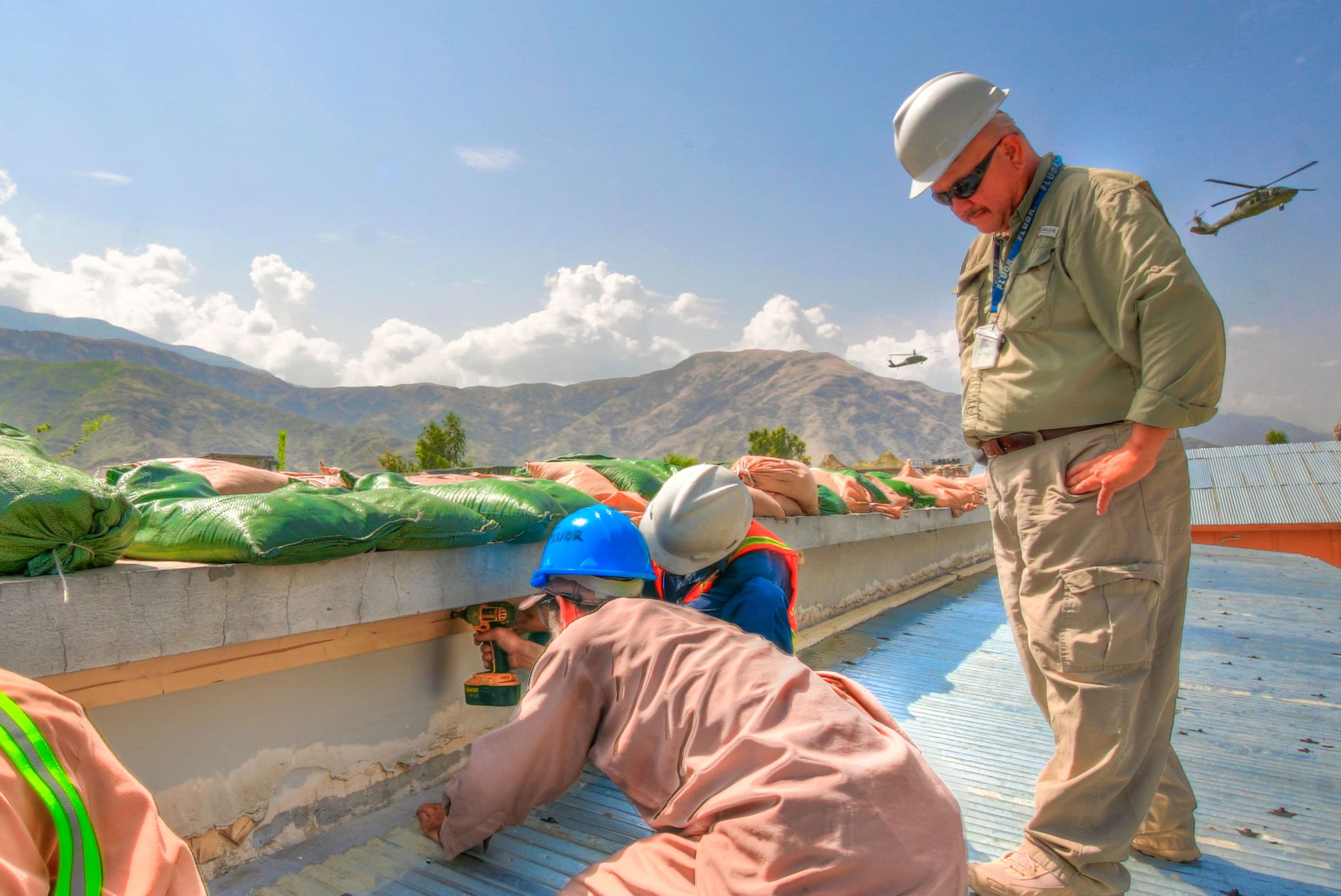 Fluor workers drilling