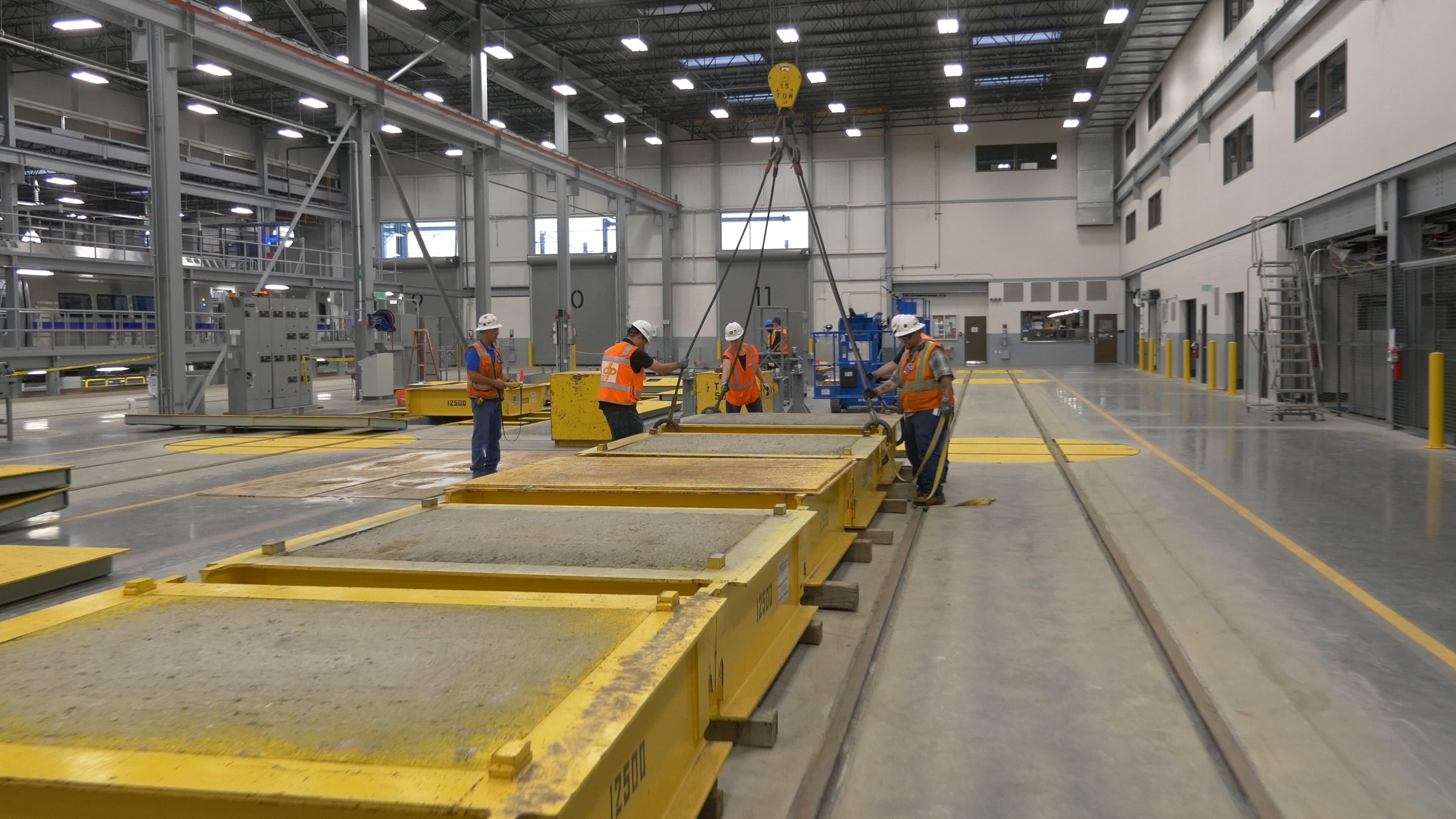 Photo of workers inside facility under construction